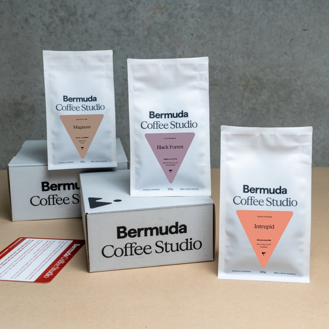 Selection of four coffee bags, labels different colours to reflect different Single Origin Coffees